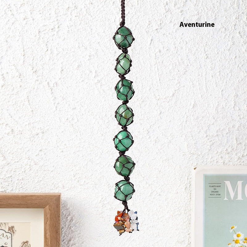 Handmade woven mesh bag with natural crystal, colorful crystal tassel pendant